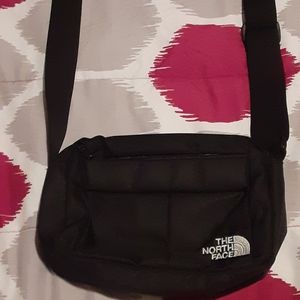 Black North Face side bag.